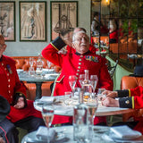 Chelsea Pensioners enjoying drinks at The Ivy by Lucy Young